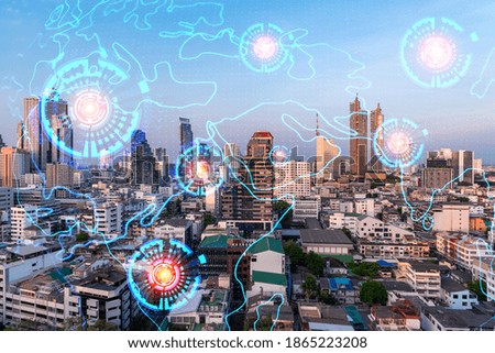 Glowing hologram of Earth planet map on aerial panoramic cityscape of Bangkok at sunset, Asia. The concept of international business. Multi Exposure.