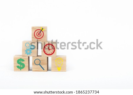 Business strategy and action plan concept. On wooden cube block.