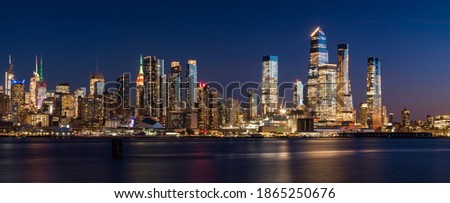Manhattan West skyline at sunset with Hudson Yards skyscrapers. Cityscape from across Hudson River, New York City, NY, USA