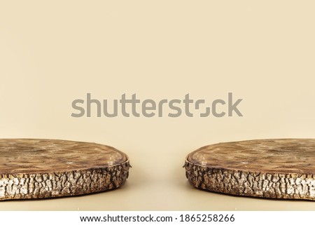 Natural empty wooden stand as cross section of birch tree for presentation and exhibitions on pastel background. Abstract empty podium for organic cosmetic products. Minimal style.