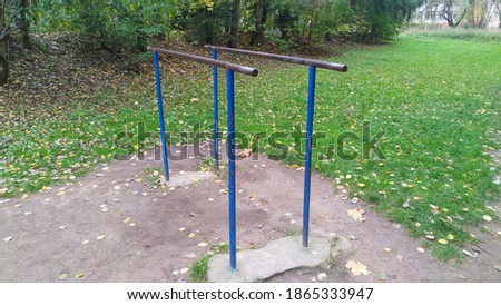 Gymnastic bars for strength exercises in the city Park