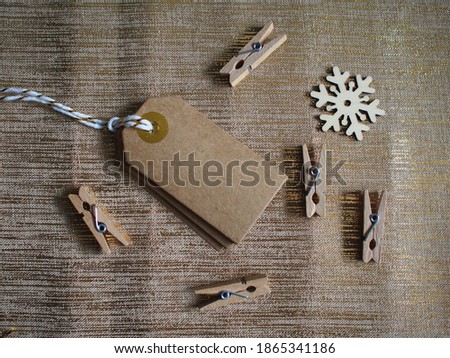 Aerial view of small clips, kraft cards and wrapping paper