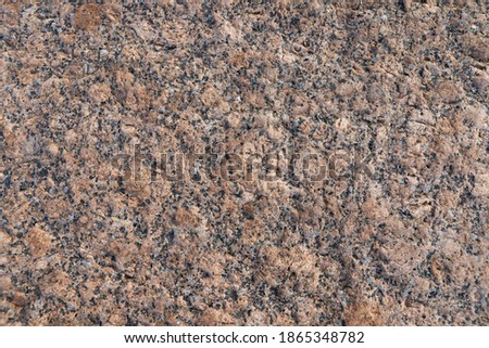 Natural brown granite stone surface, background photo texture