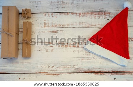 christmas gifts and christmas decoration on a wooden background