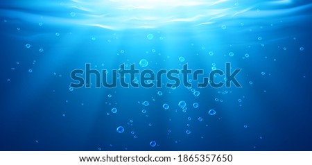 Underwater background, water surface, ocean, sea, swimming pool transparent aqua texture with air bubbles, ripples and sun rays falling, template for advertising. Realistic 3d vector illustration Royalty-Free Stock Photo #1865357650
