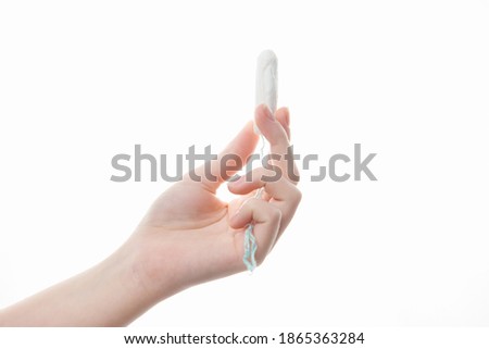 tampon in the girl's hand