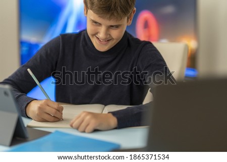 A boy takes an online lesson.Close up photo.