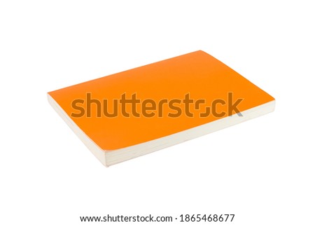 Paperback book with orange cover on white isolated background