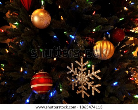 Christmas lights and ornaments hanging on a tree(selective focus)