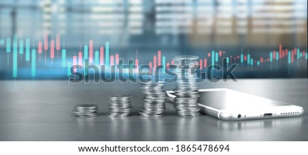 smartphone screen next to growing piles of coins and chart positive indicators in his business