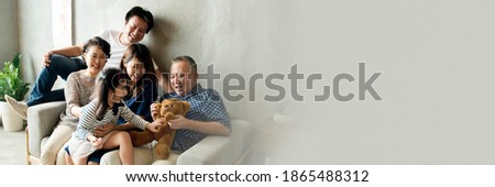 Happy extended Asian family spending time together blank space  Royalty-Free Stock Photo #1865488312