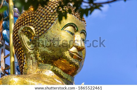 Close Up of the face of buddha at Wat Namtok Thammarot Rayong province Thailand