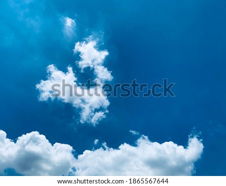 The blue sky and white cumulus clouds spread beautifully and clearly.