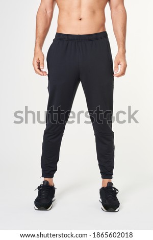 Men's black sweatpants with running shoes Royalty-Free Stock Photo #1865602018