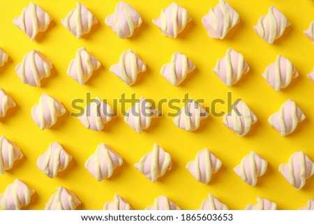 Flat lay with marshmallow on yellow background