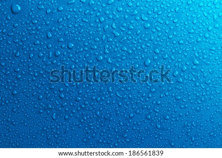 Blue water drops background Royalty-Free Stock Photo #186561839