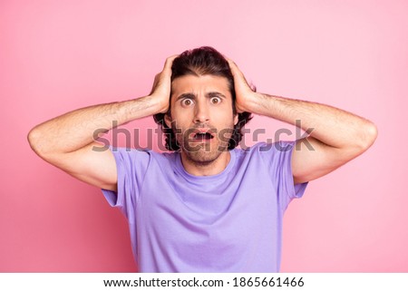 Photo of frustrated guy palms head shocked face wear purple t-shirt isolated pastel pink color background