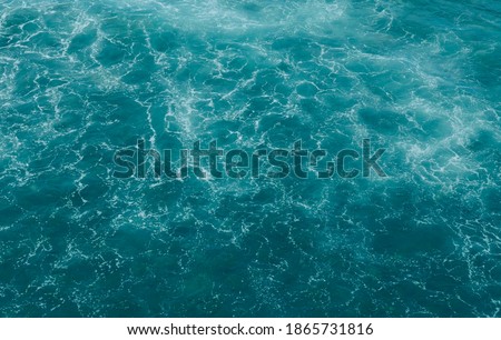 Tidewater Green ocean waves creative abstract toned background.Modern texture.
Contemporary art.Color of the year 2021.Selective focus. Royalty-Free Stock Photo #1865731816