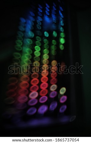 blurry background pic seven, swirly  colorful rounded lights pattern  on black 