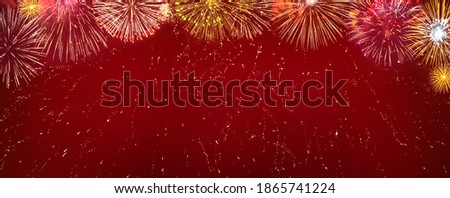 Beautiful celebration background of glitter lights and fireworks. Frame of  fireworks on red background, Panoramic Template for design web banner or flyer for Christmas holidays, New year, anniversary