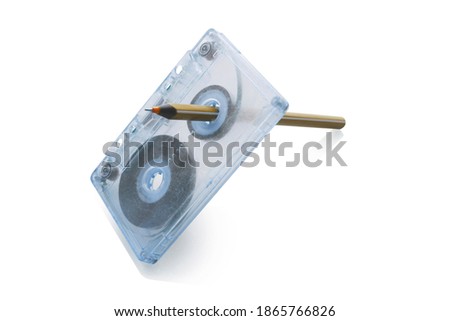 Rewind tape on cassette isolated on white background. Royalty-Free Stock Photo #1865766826