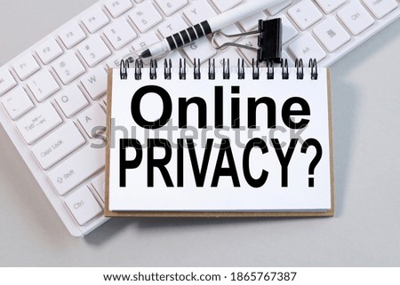 ONLINE PRIVACY? Text on white paper on gray background on computer keyboard