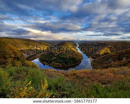 Beautiful view on the Saar river bend with amazing autumn colors Royalty-Free Stock Photo #1865770177