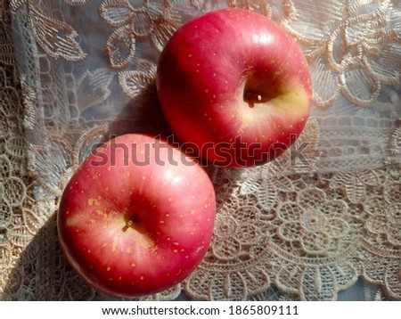 Gala Apple, Malus Domestica, Originally from New Zealand, a cross between kids orange apples and golden delicious apples. These apples are medium in size and round in shape, and have a reddish-orange 