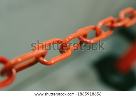 Close up view of orange plastic chain