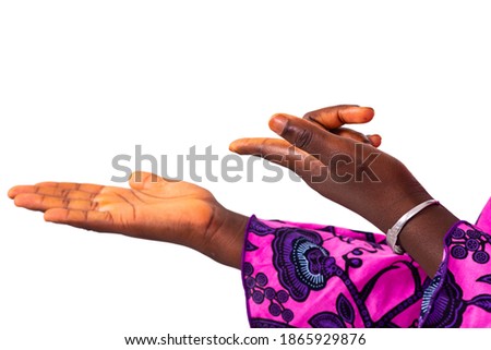 close up of a woman's index finger pointing at empty space on the palm. isolated on white background.