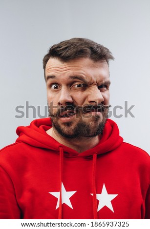 Calm and crazy. Young man with dual emotions combination on face isolated on white background, emotional and expressive. Concept of phycology, mental health, person unique, facial expression, sales