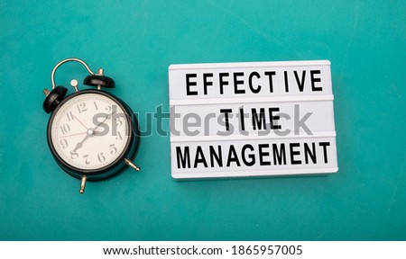 Effective time management sign with black clock on side
