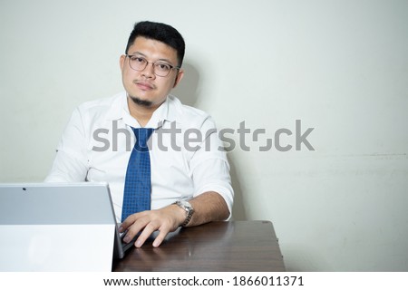 Young businessman Sitting at his desk to work
Office work ideas In a white background