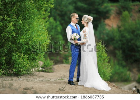 a man and a woman at a wedding photo shoot