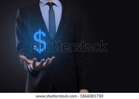 Successful international financial symbol sinvestment concept with businessman man person hold showing growth, charts and dollar sign, digital technology.