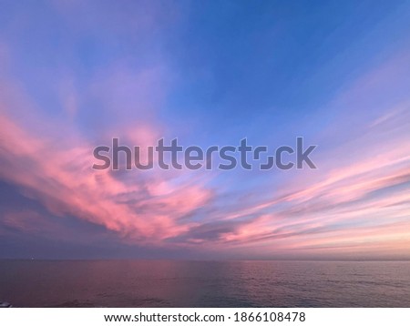 Warm colored clouds above the Mediterranean Sea Royalty-Free Stock Photo #1866108478