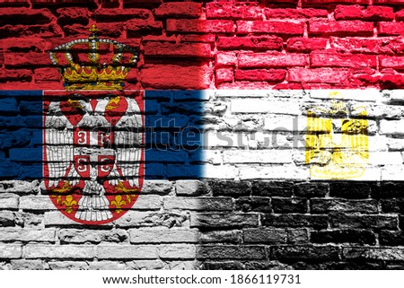 Flag of Serbia and Egypt on brick wall
