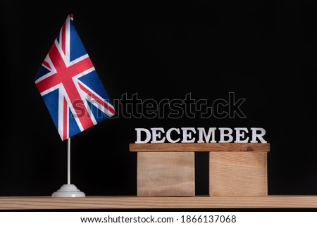 Wooden calendar of December with Great Britain flag on black background. Winter holidays of UK