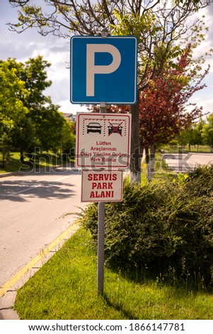 "Parking sign" for public parking space "please park your vehicles towards the exit " "service parking area " warning signs.