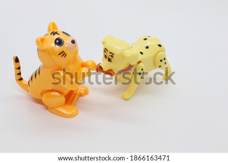 toy dog ​​and cat figures isolated in white color.