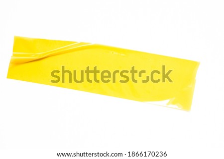 yellow tapes on white background. Torn horizontal and big size yellow sticky tape, adhesive pieces.