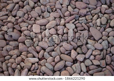 Natural pebbles from the river come together to form a beautiful stone walkway.