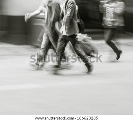 City business people walking in the commercial street, black and white blur background