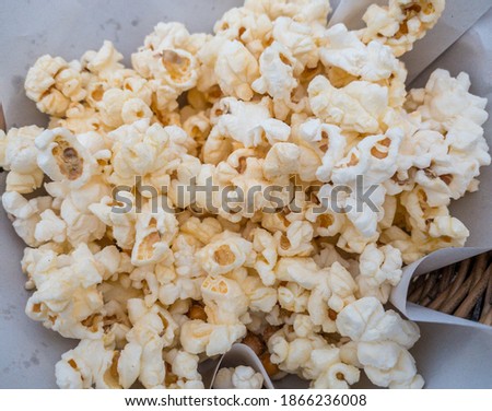 Top view of the salty flavor popcorn in the woven bamboo basket
