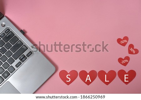 Layout, top view for valentine's day online shopping and sales. notebook, hearts. the inscription on the hearts of sale.