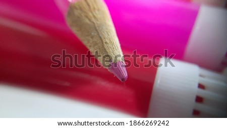 Bright pink and red pencil color on pink background