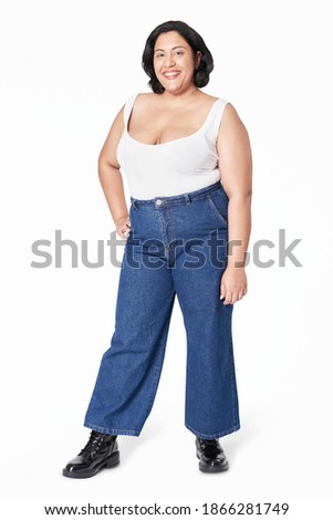 Plus size women's top and jeans fashion studio shot