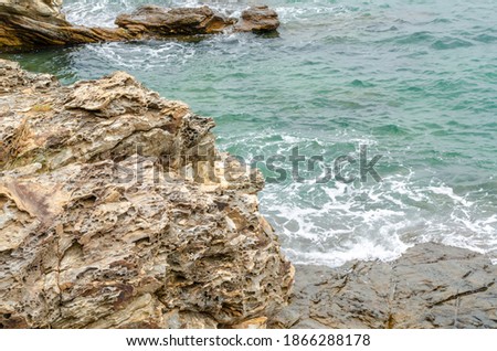 sea waves and rock coast, seascape in Thailand