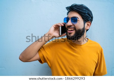 Young man talking on the phone.