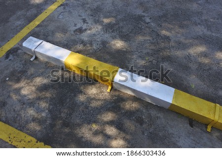 
Concrete floor and traffic signs in yellow